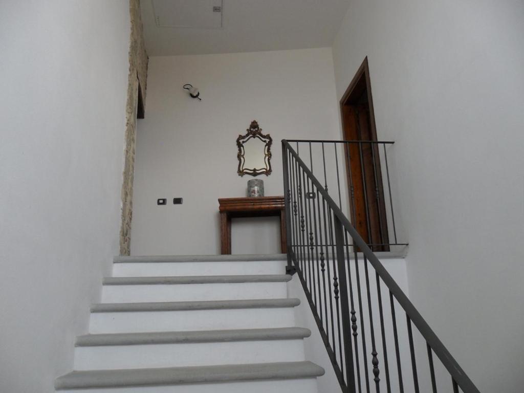 a stairway with white steps and a stair railing at Mini Habitat Monte Santa Maria in Monte Santa Maria Tiberina