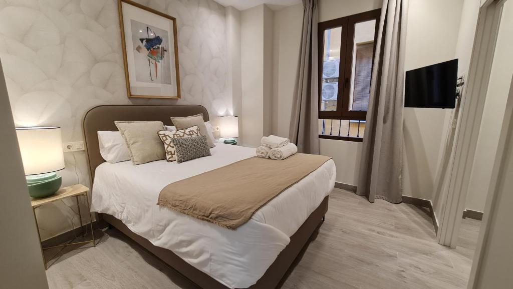 Giường trong phòng chung tại Suspiro Penthouse 302 by Florentia Homes