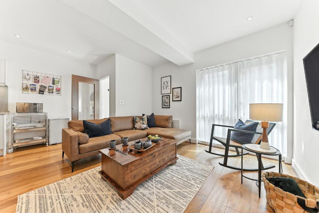 a living room with a couch and a table at Springfield Two in Harrogate