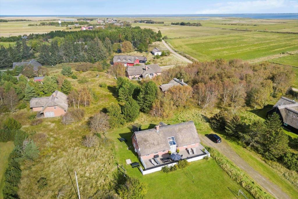 an aerial view of a house in a field at 2005-Romo-Thadesvej-14 in Høm