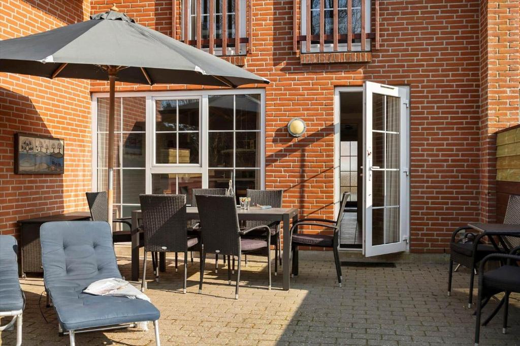 En terrasse eller udendørsområde på 0207-Romo-Havnebyvej-59-F