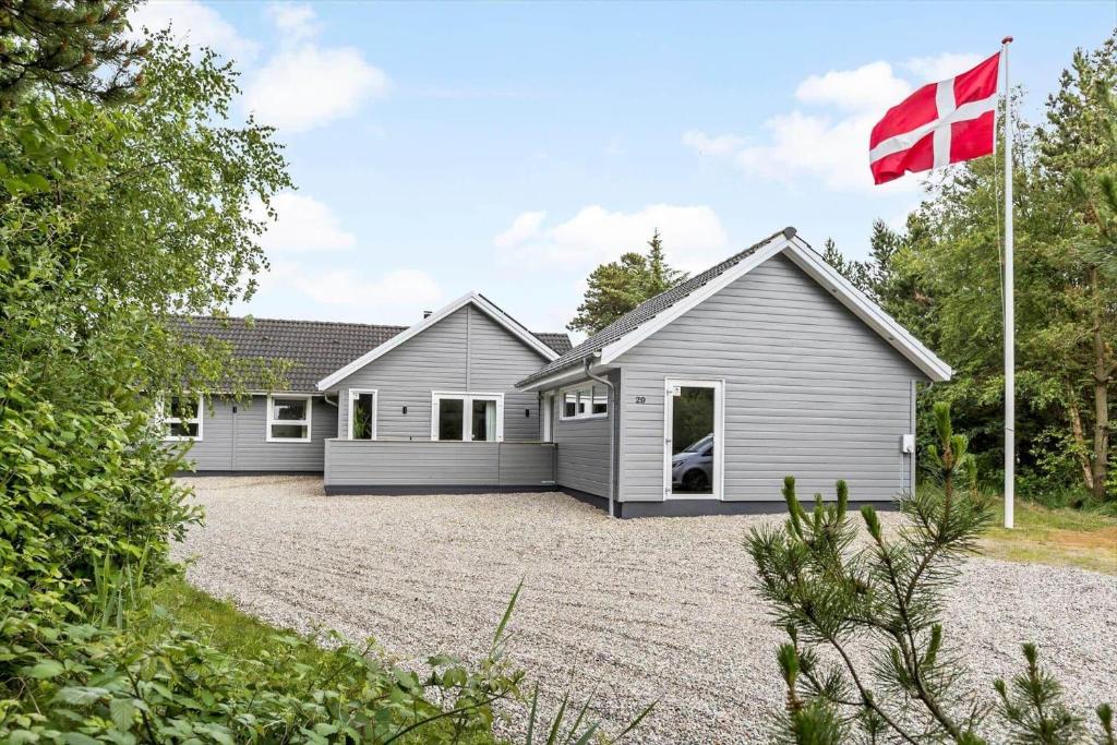 a house with a canadian flag in front of it at 0498-Romo-Godthabsvej-29 in Høm