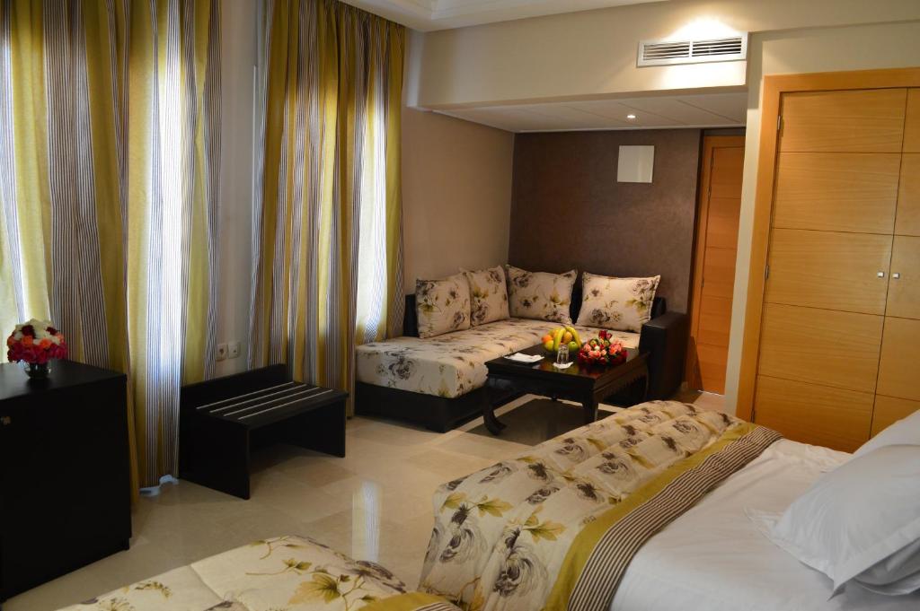 Postel nebo postele na pokoji v ubytování Hotel La Luna