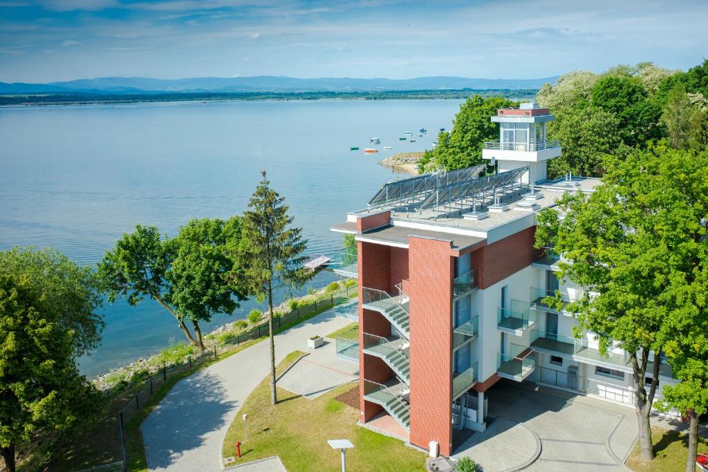 an aerial view of a building next to a body of water at Ośrodek Wypoczynkowy Rybak in Nysa