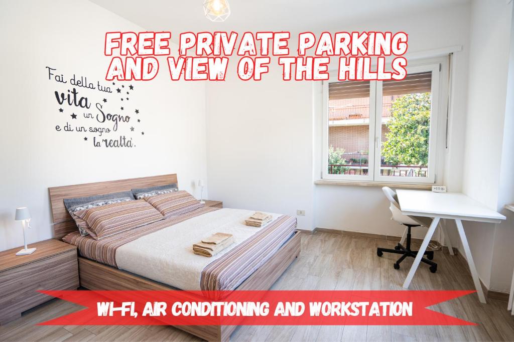 a bedroom with a bed and a desk and a window at Private Parking, with Hill View in Alba