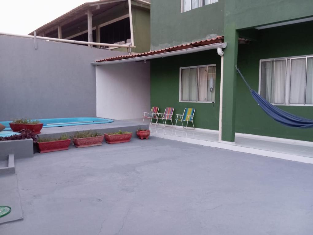 Πισίνα στο ή κοντά στο Casa pousada verde Guarapari