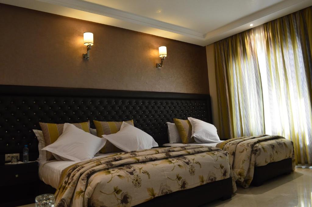 Postel nebo postele na pokoji v ubytování Hotel La Luna