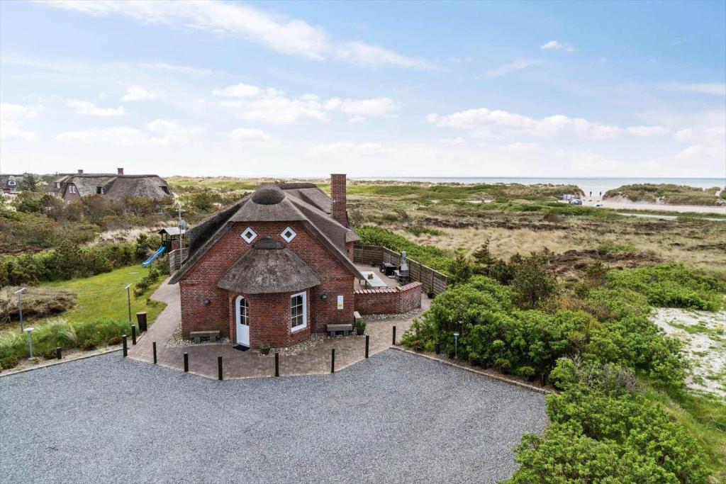 an aerial view of a house with a thatched roof at BV277-Blavand-Klitvej-4 in Blåvand