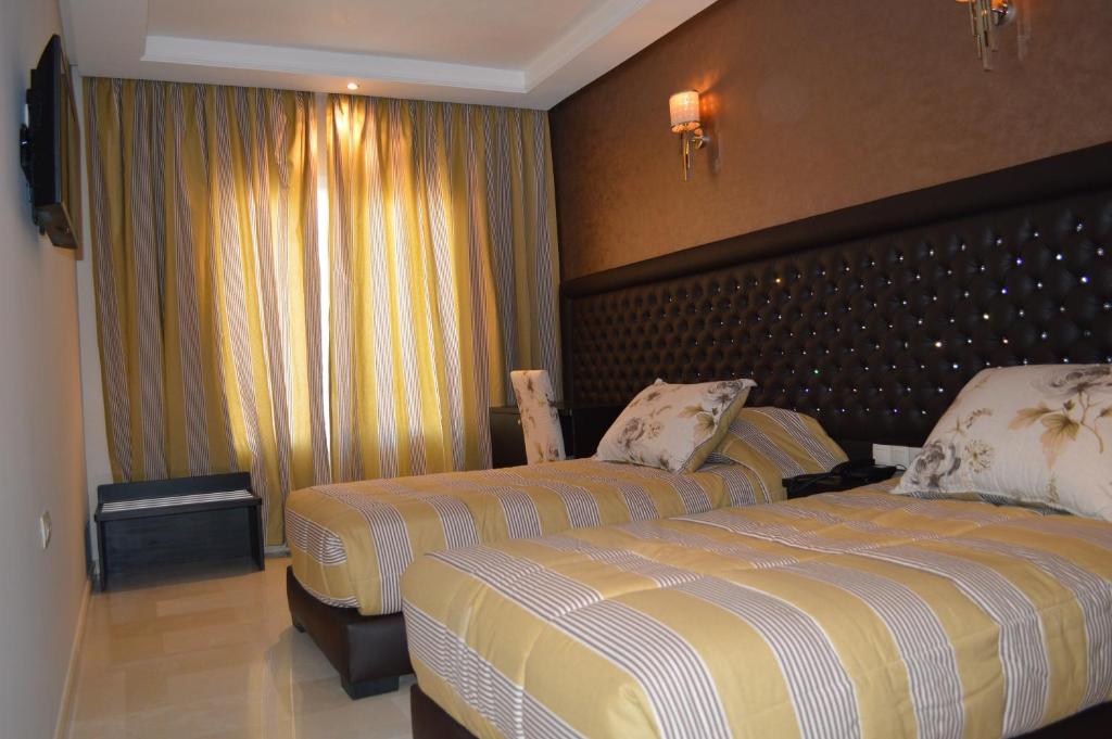 Postel nebo postele na pokoji v ubytování Hotel La Luna