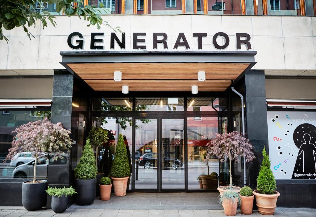 a store front of a store with potted plants at Generator Stockholm in Stockholm