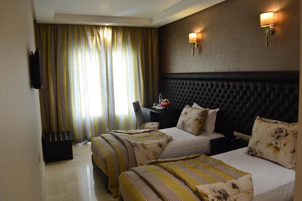 Postel nebo postele na pokoji v ubytování Hotel La Luna