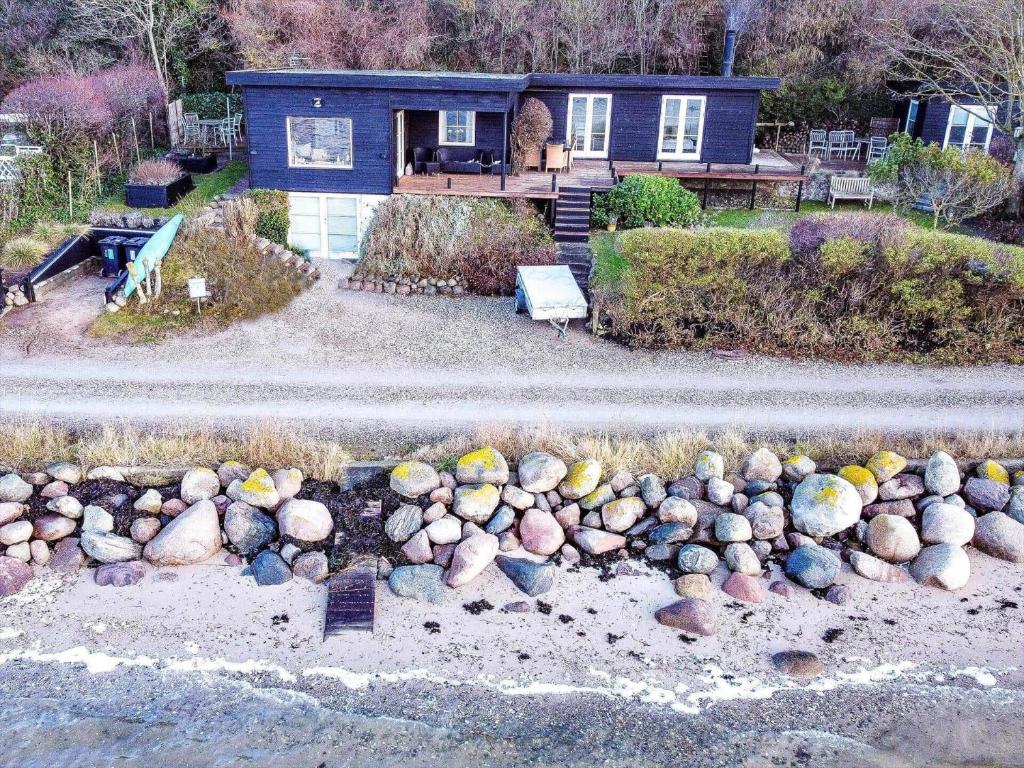 an aerial view of a house with a bunch of rocks at FJ3200-Frederikssund-Strandvej-58 in Frederikssund