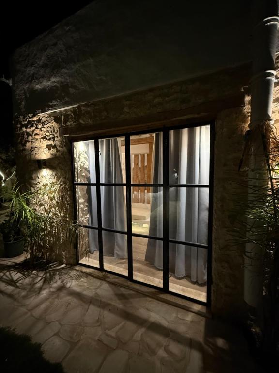 an open window with curtains in a room at Casa Dea - Bungalow Aphrodite in Hammamet Sud