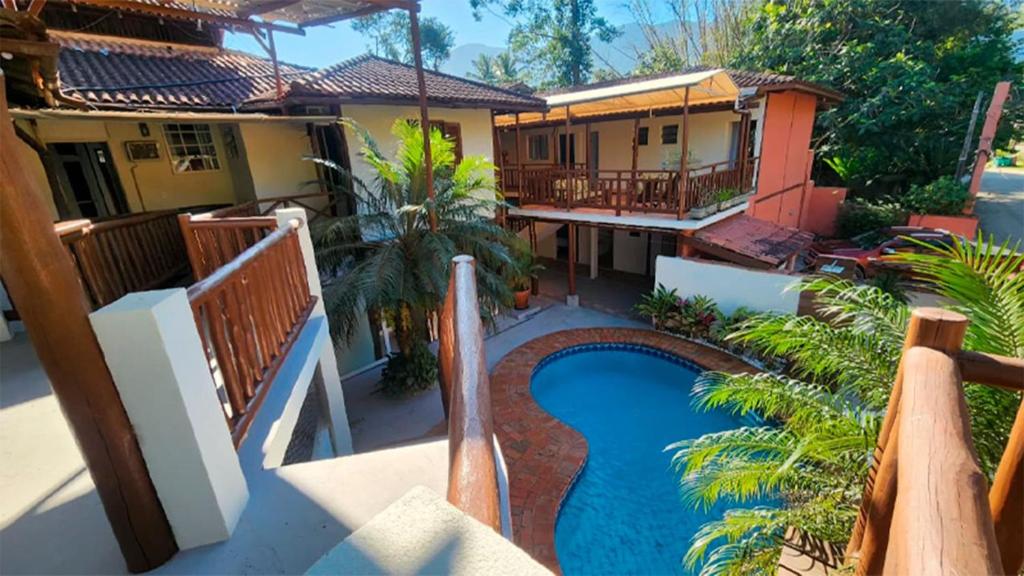 a view of a house with a swimming pool at Pousada Numar Maresias in Maresias