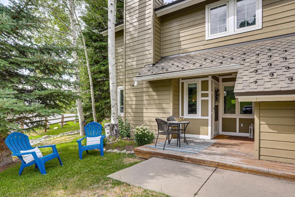 two blue chairs and a table outside of a house at Hike, Ski and Golf Fully Renovated Edwards Townhome in Edwards