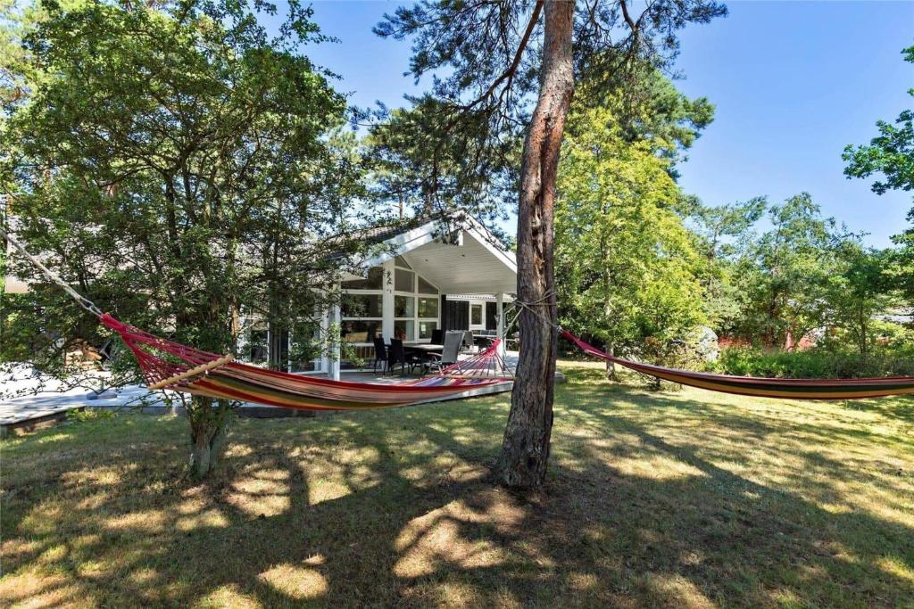 a hammock in the yard of a house at 11153-Nykobing-Sj-Lyngvejen-27 in Nykøbing Sjælland