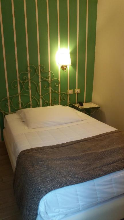 Postel nebo postele na pokoji v ubytování Hotel Borgo Antico