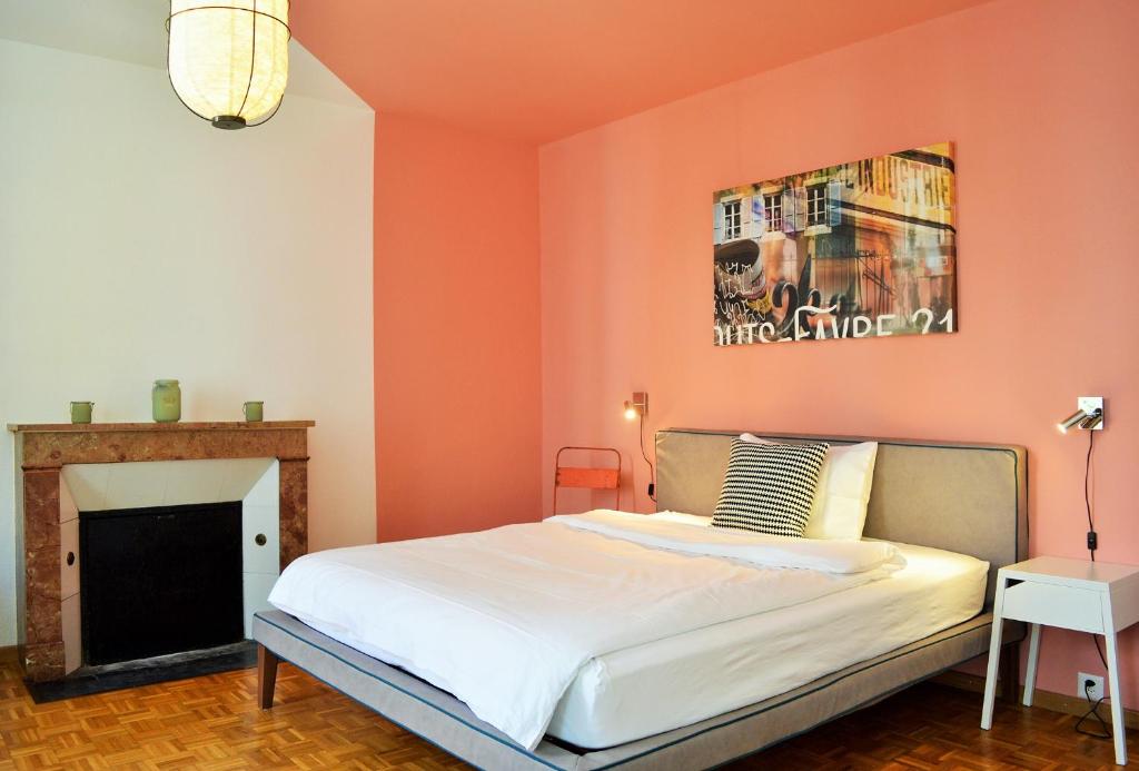 Postel nebo postele na pokoji v ubytování B&B Louis-Favre 21