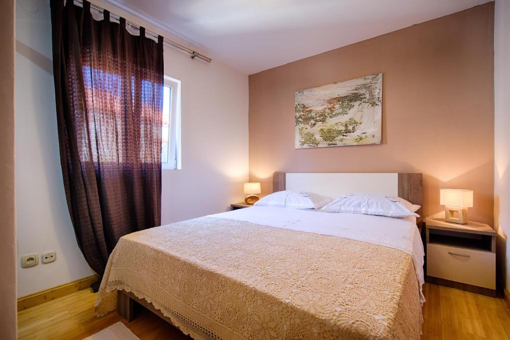 Postel nebo postele na pokoji v ubytování Apartments Villa Anka
