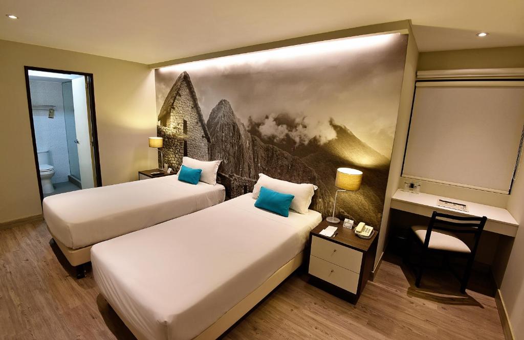 Llit o llits en una habitació de Mariel Hotel Boutique