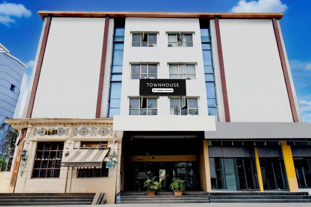 a building with a sign that reads tokyo house at Super Townhouse Narayanaguda Metro Station Formerly Hotel Anshu Grand in Vidya Nagar