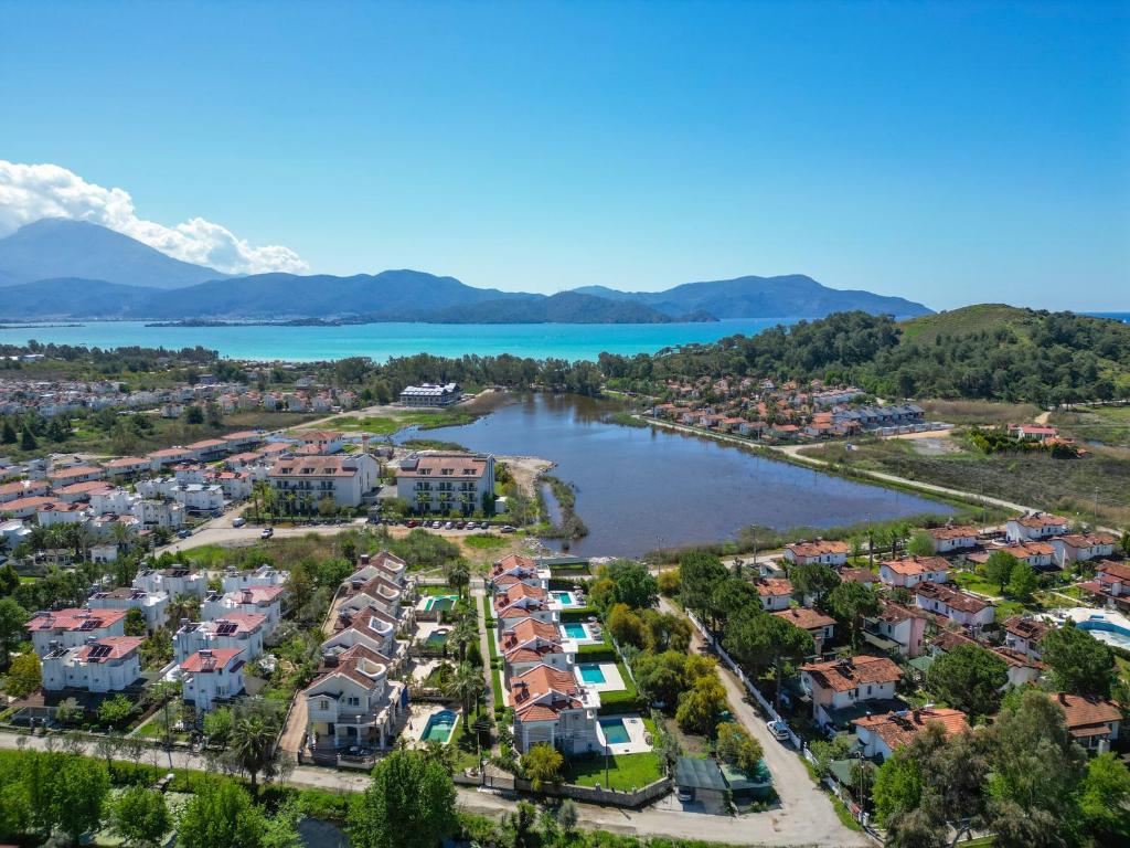 an aerial view of a residential neighborhood next to a lake at Villa Calis 1 in Fethiye