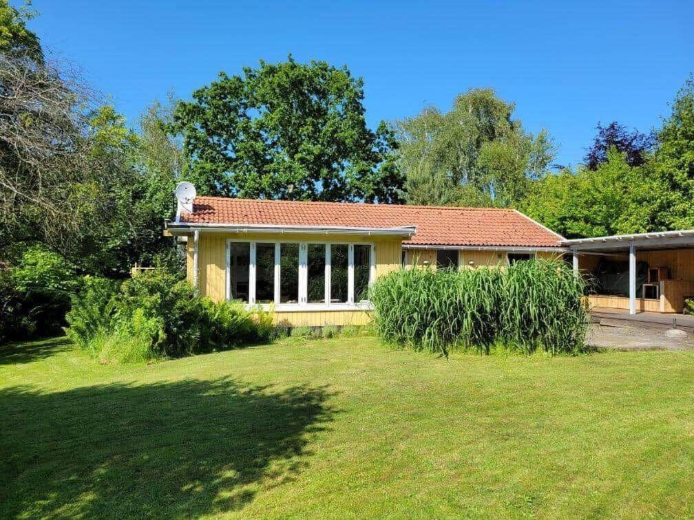 a house with a grass yard in front of it at 13374-1-Vig-Thorsvej-4 in Vig