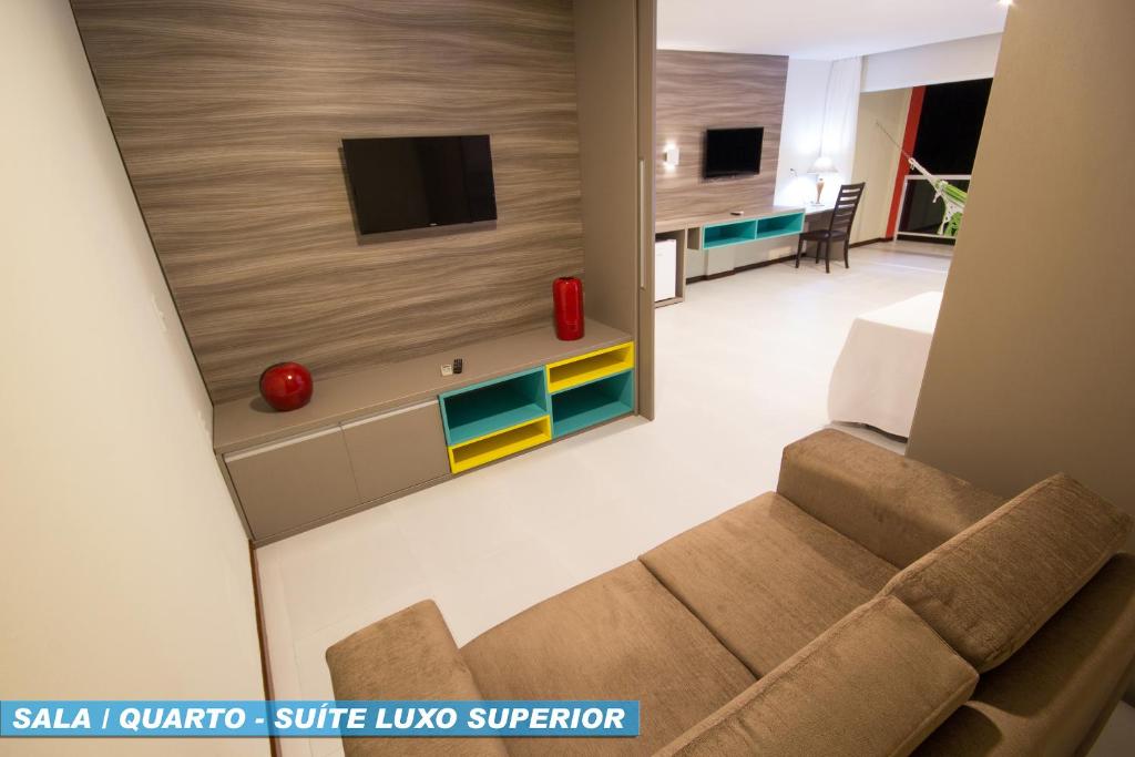 TV a/nebo společenská místnost v ubytování Hotel Praia Dourada