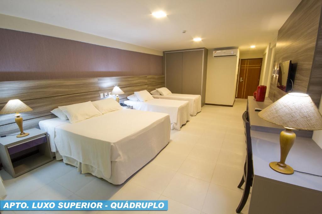 Postel nebo postele na pokoji v ubytování Hotel Praia Dourada