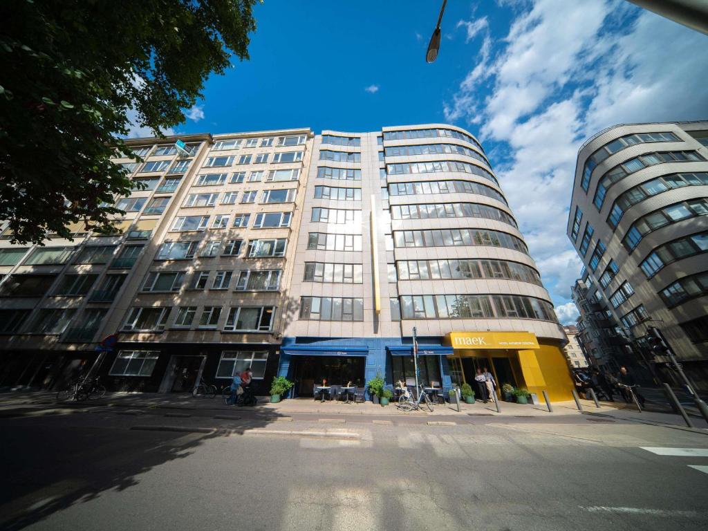 a tall building with a street in front of it at Maek Hotel Antwerp Central - Handwritten Collection in Antwerp