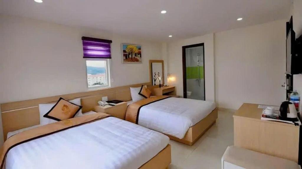 Giường trong phòng chung tại Yellow Sea Hotel Nha Trang