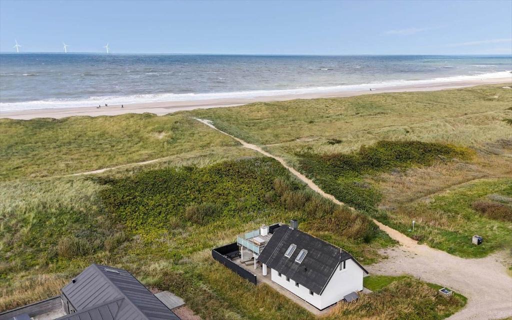 an aerial view of a house on the beach at 347-Harboore-Slettevej-71 in Harboør