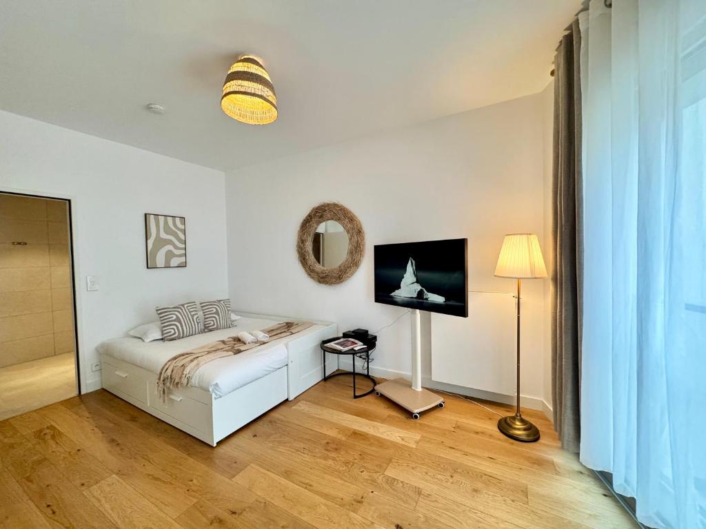 Ένα ή περισσότερα κρεβάτια σε δωμάτιο στο Le Studio Mail, Centre de Rennes