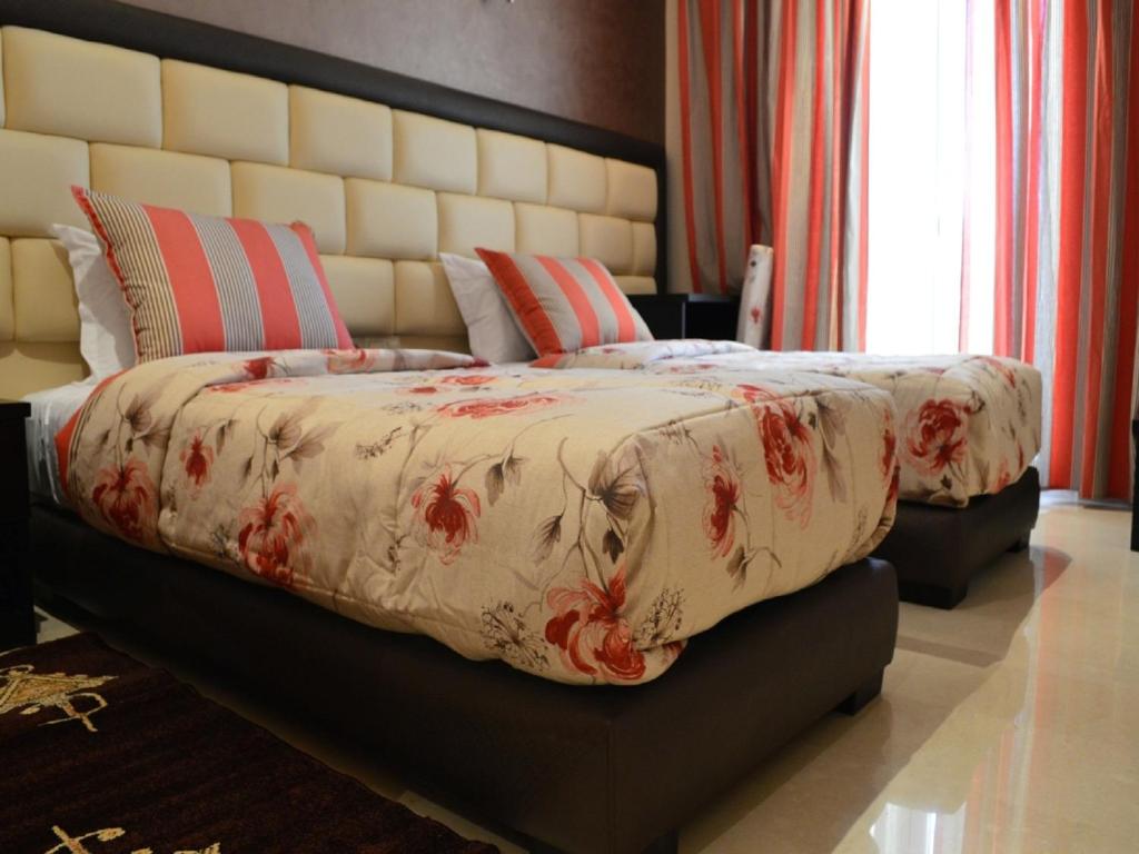 Postel nebo postele na pokoji v ubytování Hotel La Luna