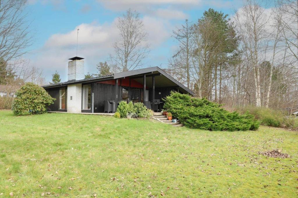 a house on a grassy field with a building at 13371-1-Vig-Tjornedalen-3 in Vig