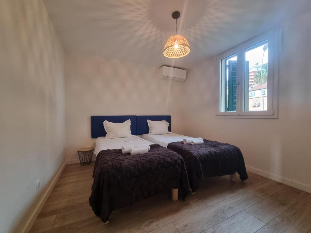Postel nebo postele na pokoji v ubytování LARVOTTO Plage Monaco & Terrasse