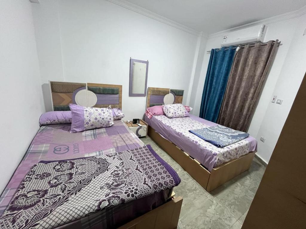 Ένα ή περισσότερα κρεβάτια σε δωμάτιο στο Blubay VIP