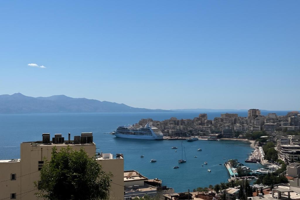 a cruise ship in a large body of water at k&k apartament in Sarandë