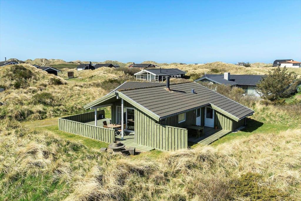 a house sitting on top of a hill at BL1462-Saltum-Revlingevej-32 in Saltum