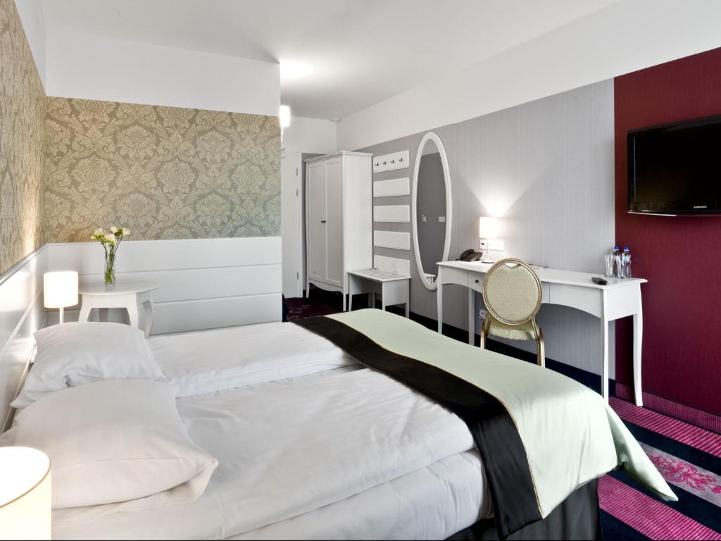 Postel nebo postele na pokoji v ubytování Hotel Lamberton