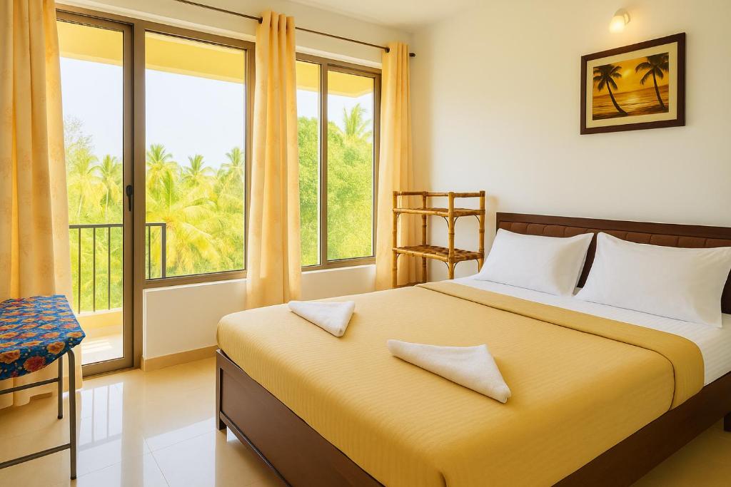 Ένα ή περισσότερα κρεβάτια σε δωμάτιο στο 1 bhk Home Palolem Beach