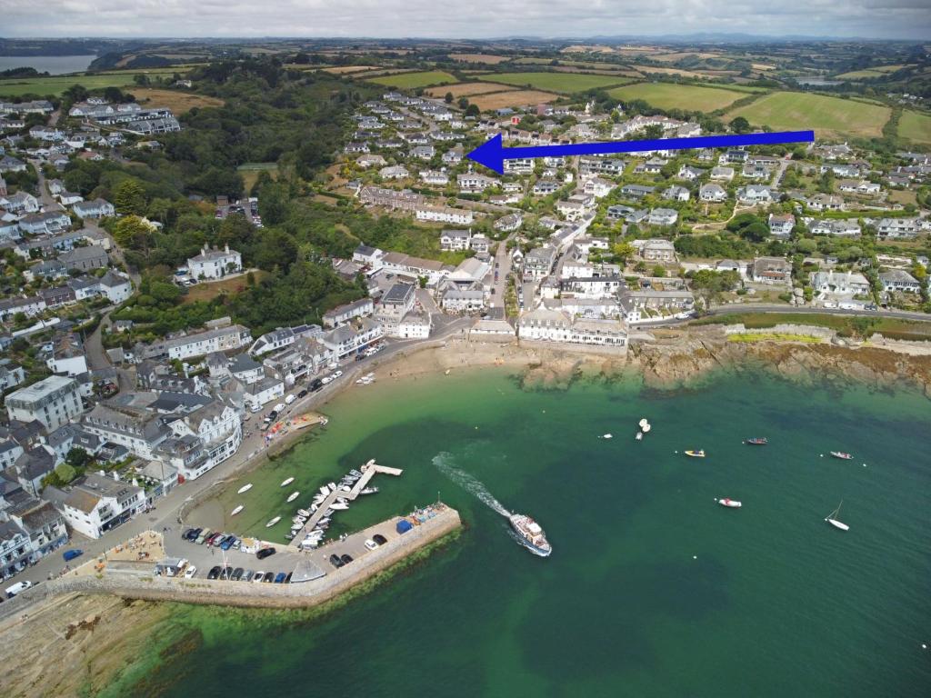an aerial view of a harbor with boats in the water at Highlands in Saint Mawes
