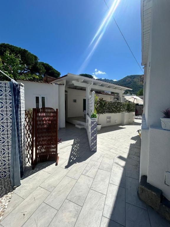 a house with a gate in front of a yard at Dimora del Verde in Forio d'Ischia