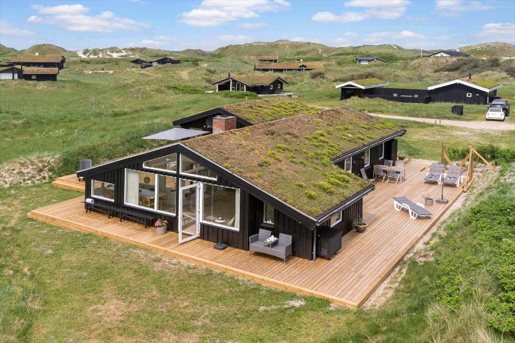 an image of a house with a grass roof at BL1020-Pandrup-Hunetorp-Klitvej-257 in Pandrup