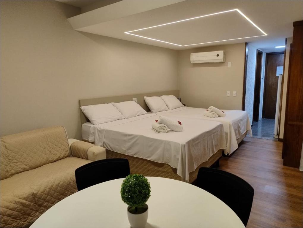 Ένα ή περισσότερα κρεβάτια σε δωμάτιο στο Flat Encanto Baiano