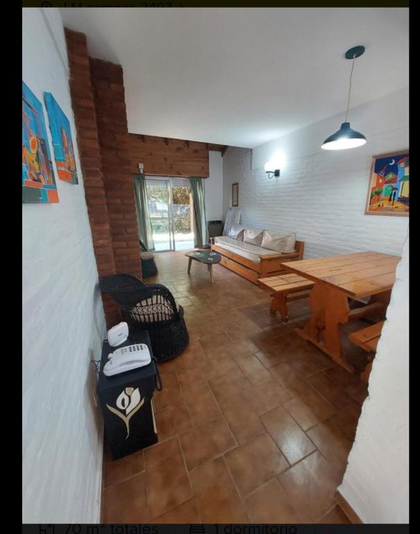 a living room with a couch and a table at Apartamento Calamar II in Valeria del Mar