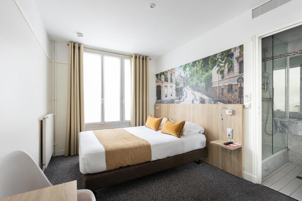 Postel nebo postele na pokoji v ubytování Hôtel Opera Lafayette