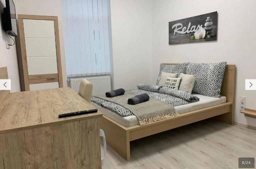 a living room with a couch and a table at Cityhall Apartments in Miskolc