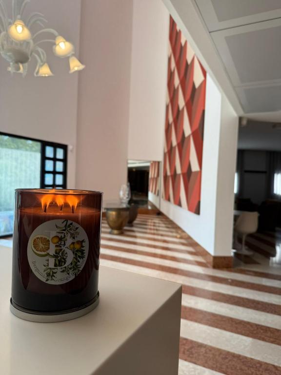 a cup of coffee sitting on a table in a room at Hotel Giada Viale del Sole in Vicenza