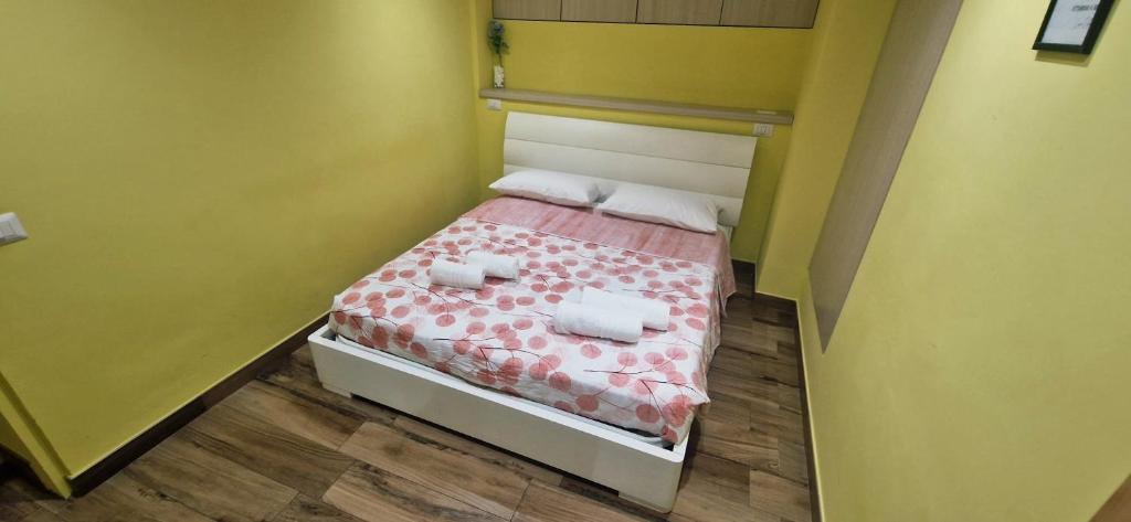 Ένα ή περισσότερα κρεβάτια σε δωμάτιο στο Casa vacanze Harmonie